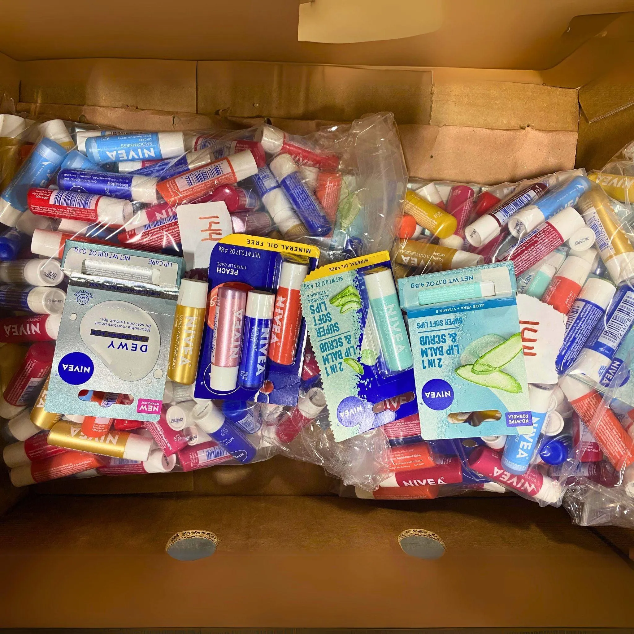 Nivea Lip Balms and Lip Scrubs Different Flavors 0.17OZ & 0.18OZ (144 Pcs Lot)